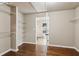 Walk-in closet with custom shelving and wood floor at 4580 Orchard Ridge Ct, Cumming, GA 30028