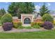 Attractive Orchard Lake community sign featuring manicured landscaping, lush trees, and a peek of the beautiful homes at 4580 Orchard Ridge Ct, Cumming, GA 30028