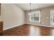 Bright dining room with hardwood floors and a sliding glass door at 4580 Orchard Ridge Ct, Cumming, GA 30028