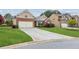 Charming single-Gathering home with a two-car garage, well-manicured lawn and beautiful landscaping at 4580 Orchard Ridge Ct, Cumming, GA 30028