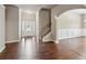 Entryway featuring hardwood floors, staircase, and natural light from front door at 4580 Orchard Ridge Ct, Cumming, GA 30028