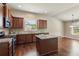 Kitchen features granite countertops, stainless appliances, tile backsplash and hardwood flooring at 4580 Orchard Ridge Ct, Cumming, GA 30028