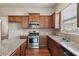 Kitchen featuring granite countertops, stainless steel appliances, tile backsplash and wood flooring at 4580 Orchard Ridge Ct, Cumming, GA 30028