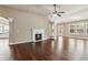 Bright living room with hardwood floors, fireplace, and plenty of natural light at 4580 Orchard Ridge Ct, Cumming, GA 30028