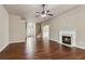 Open floor plan showing a fireplace, hardwood flooring, and view to the front entrance at 4580 Orchard Ridge Ct, Cumming, GA 30028