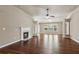 Living room featuring a fireplace, hardwood floors, and open layout at 4580 Orchard Ridge Ct, Cumming, GA 30028