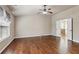 Bright main bedroom suite featuring high ceilings, ceiling fan and doorway to the main bath at 4580 Orchard Ridge Ct, Cumming, GA 30028