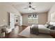 Bright main bedroom suite featuring high ceilings, ceiling fan and doorway to additional room at 4580 Orchard Ridge Ct, Cumming, GA 30028
