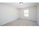 An open bedroom design with plush carpet, a neutral color scheme, and ample natural light at 56 Windom Dr, Carrollton, GA 30116