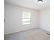Bedroom with soft carpet, a neutral wall color, and a view from the window at 56 Windom Dr, Carrollton, GA 30116