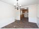 A dining area showcases hardwood floors and leads into an adjacent open kitchen space at 56 Windom Dr, Carrollton, GA 30116