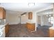 Open kitchen with wood cabinets and views of the living and dining areas at 56 Windom Dr, Carrollton, GA 30116