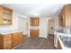Bright kitchen area featuring ample cabinet space and modern flooring at 56 Windom Dr, Carrollton, GA 30116