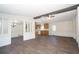 Spacious living room with modern flooring and open layout, flowing into the dining and kitchen areas at 56 Windom Dr, Carrollton, GA 30116