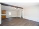 Open living room featuring modern flooring, neutral walls, and a ceiling fan at 56 Windom Dr, Carrollton, GA 30116