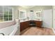Bathroom with a vanity and dual sinks and lots of natural light at 602 Redbud Ter, Canton, GA 30115