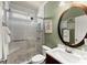 Modern bathroom with tiled shower, pebble floor, and updated vanity at 602 Redbud Ter, Canton, GA 30115