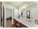 Bathroom vanity with dual sinks and decorative lighting at 602 Redbud Ter, Canton, GA 30115