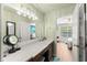 Bathroom with vanity, dual sinks, and decorative lighting at 602 Redbud Ter, Canton, GA 30115