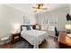 Cozy bedroom with natural light, ceiling fan, and wood flooring at 602 Redbud Ter, Canton, GA 30115