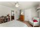 Comfortable bedroom with a neutral palette, featuring a ceiling fan and natural light at 602 Redbud Ter, Canton, GA 30115