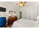 Comfortable bedroom featuring natural light, a dresser, and a mirror at 602 Redbud Ter, Canton, GA 30115