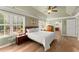 Bright bedroom with hardwood floors, large windows and a ceiling fan at 602 Redbud Ter, Canton, GA 30115