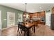 Open dining area adjacent to a kitchen featuring stainless steel appliances and ample natural light at 602 Redbud Ter, Canton, GA 30115