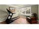 Relaxing exercise room with hardwood floors, natural light and comfortable chair at 602 Redbud Ter, Canton, GA 30115