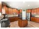 Well-equipped kitchen boasts stainless steel appliances, custom cabinetry, and center island at 602 Redbud Ter, Canton, GA 30115