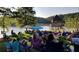 Outdoor gathering featuring lakeside views, a gazebo, and a spacious lawn area for community events and relaxation at 602 Redbud Ter, Canton, GA 30115