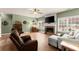 Inviting living room featuring a fireplace, large windows, and comfortable seating at 602 Redbud Ter, Canton, GA 30115
