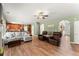 Open-concept living room with hardwood floors and plenty of seating space at 602 Redbud Ter, Canton, GA 30115