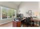 Bright office with laminate floors, large window, and two computer monitors at 602 Redbud Ter, Canton, GA 30115