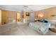 Large bedroom featuring a window, neutral carpet, and two doors at 6048 Kings Mountain Way, Tucker, GA 30087