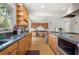 Spacious kitchen boasting granite countertops, wood cabinets, stainless steel appliances, and ample counter space at 6048 Kings Mountain Way, Tucker, GA 30087
