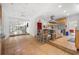 Bright kitchen featuring stainless steel appliances, an island with seating, and access to adjacent rooms at 6048 Kings Mountain Way, Tucker, GA 30087
