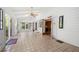 Bright sunroom with tile flooring, multiple windows, and access to the outdoors for relaxing or entertaining at 6048 Kings Mountain Way, Tucker, GA 30087