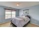 A bright bedroom with a bed, window, and decor, creating a cozy and inviting atmosphere at 725 Martin Field Dr, Lawrenceville, GA 30045