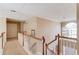 Second floor hallway with hardwood floors and a beautiful window at 725 Martin Field Dr, Lawrenceville, GA 30045