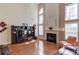 Spacious living room with hardwood floors, fireplace, soaring ceilings, and lots of natural light at 725 Martin Field Dr, Lawrenceville, GA 30045