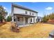 Spacious backyard with a covered porch and lush landscaping at 1010 Coleman Place Dr, Roswell, GA 30075