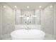 This bathroom has a standalone tub and a marble tile shower with glass doors at 1010 Coleman Place Dr, Roswell, GA 30075