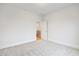 Bedroom with neutral carpeting and view to the stairs at 1010 Coleman Place Dr, Roswell, GA 30075
