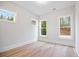 This bedroom is bright, has hardwood floors and is illuminated by three big windows at 1010 Coleman Place Dr, Roswell, GA 30075