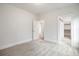 Bedroom featuring neutral carpet, baseboard trim and doorways to other spaces at 1010 Coleman Place Dr, Roswell, GA 30075