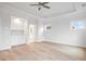 Bright bedroom featuring hardwood floors, windows, a ceiling fan and built in cabinetry at 1010 Coleman Place Dr, Roswell, GA 30075