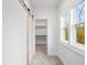 Walk-in closet featuring window and adjustable shelving at 1010 Coleman Place Dr, Roswell, GA 30075