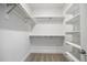 Spacious closet offering plentiful shelving and a carpeted floor at 1010 Coleman Place Dr, Roswell, GA 30075