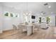 Elegant dining area with modern chandelier, adjacent to the living area at 1010 Coleman Place Dr, Roswell, GA 30075